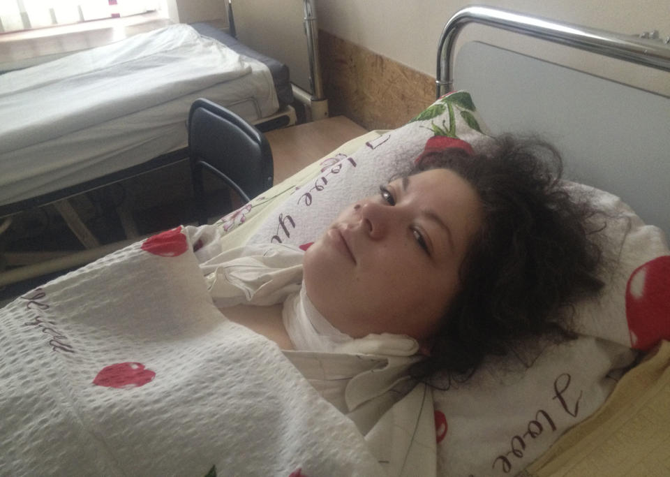 Olesya Zhukovska lies on her hospital bed in Kiev, Ukraine, Friday, Feb. 21, 2014. “I am dying,” Olesya Zhukovska, a 21-year-old volunteer medic wrote on Twitter, minutes after she got hit in the neck by a sniper bullet as deadly clashes broke out in the center of the Ukrainian capital between protesters and police. But miraculously, Zhukovska survived, becoming a symbol of the three month-long protest against President Viktor Yanukvoych’s government. (AP Photo/Maria Danilova)