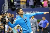 Novak Djokovic of Serbia hits a ball into the stands after his match against Jo-Wilfried Tsonga of France (not pictured) on day nine of the 2016 U.S. Open tennis tournament at USTA Billie Jean King National Tennis Center. Djokovic won 6-3, 6-2, (ret.) Mandatory Credit: Geoff Burke-USA TODAY Sports