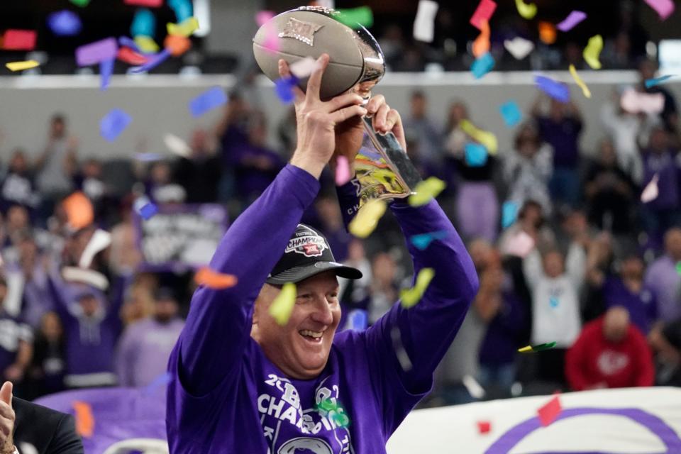 Kansas State head coach Chris Klieman holds the trophy after beating TCU in the Big 12 title game Saturday.
