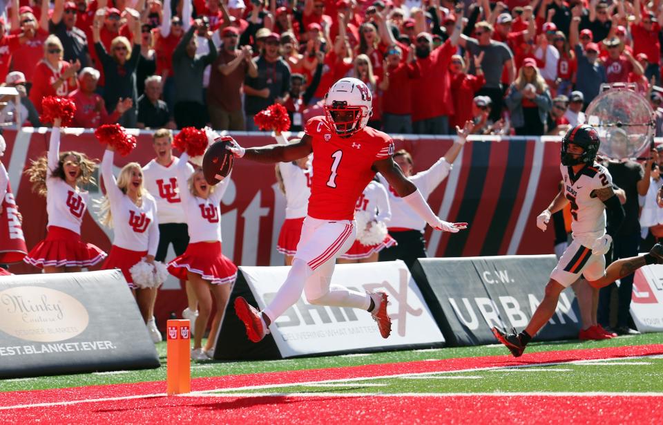 Utah Utes cornerback Clark Phillips III glides into the end zone after intercepting a pass against Oregon State.
