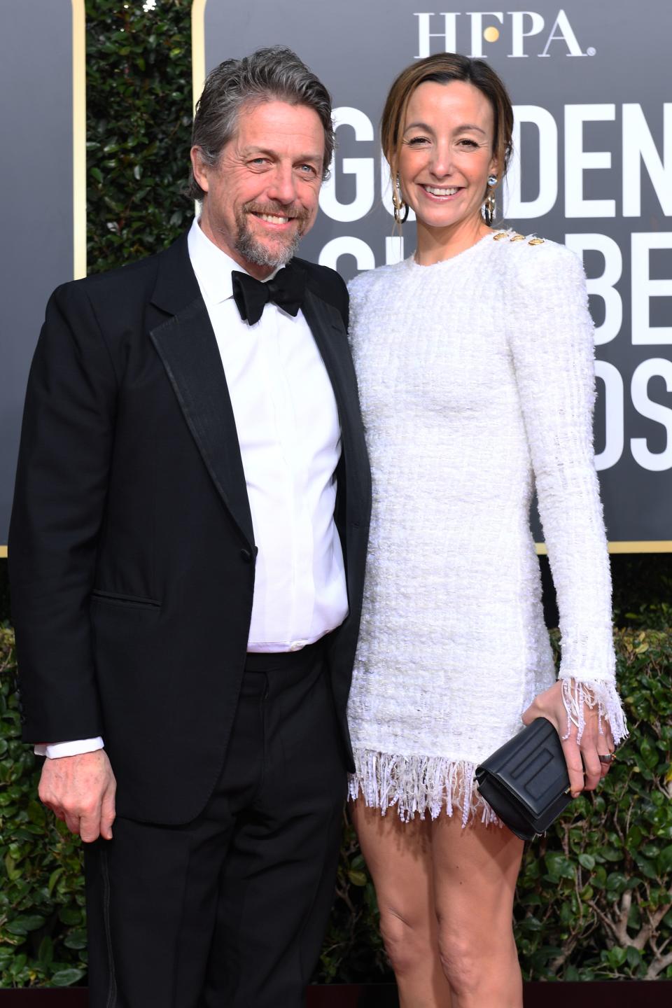 Best Performance by an Actor in a Limited Series or Motion Picture Made for Television for ‘A Very English Scandal’ nominee Hugh Grant (L) and his wife producer Anna Elisabet Eberstein arrive for the 76th annual Golden Globe Awards on January 6, 2019. (Photo by VALERIE MACON / AFP)