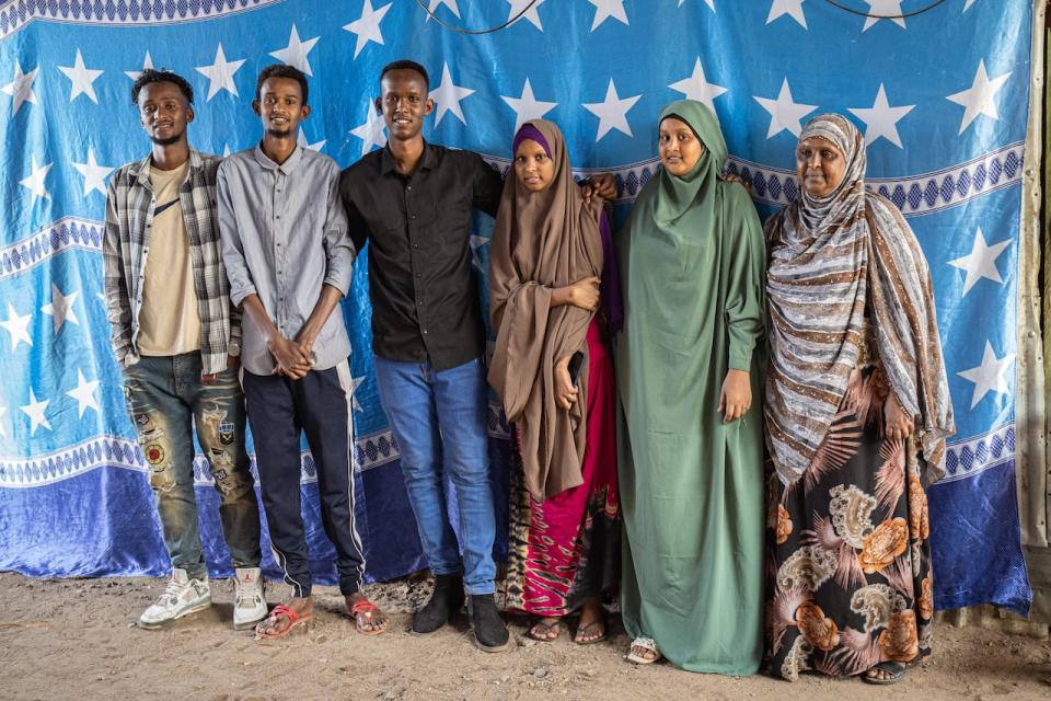 Abdifatah Sabriye, wearing black, with his two brothers, two sisters and their mother at their home inside the Kakuma refugee camp. Abdisamad Sabriye, second from left, died two weeks before his brother came to Canada. He was around 24 years old.