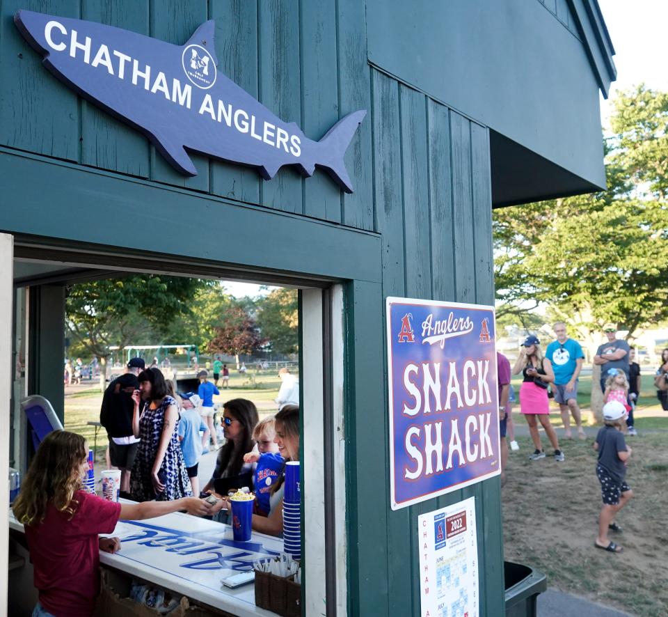 CHATHAM   07/13/22 Customers line up at the Chatham snack shack during the game with Hyannis.