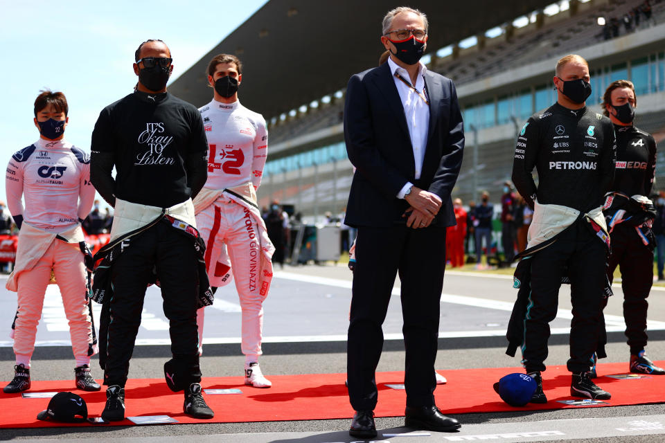 Stefano Domenicali, CEO of the Formula One Group stands on the grid for the national anthem next to Lewis Hamilton of Great Britain and Mercedes GP and Valtteri Bottas of Finland and Mercedes AMG Petronas before the F1 Grand Prix of Portugal at Autodromo Internacional Do Algarve on May 02, 2021 in Portimao, Portugal. / Credit: Dan Istitene - Formula 1/Formula 1 via Getty Images