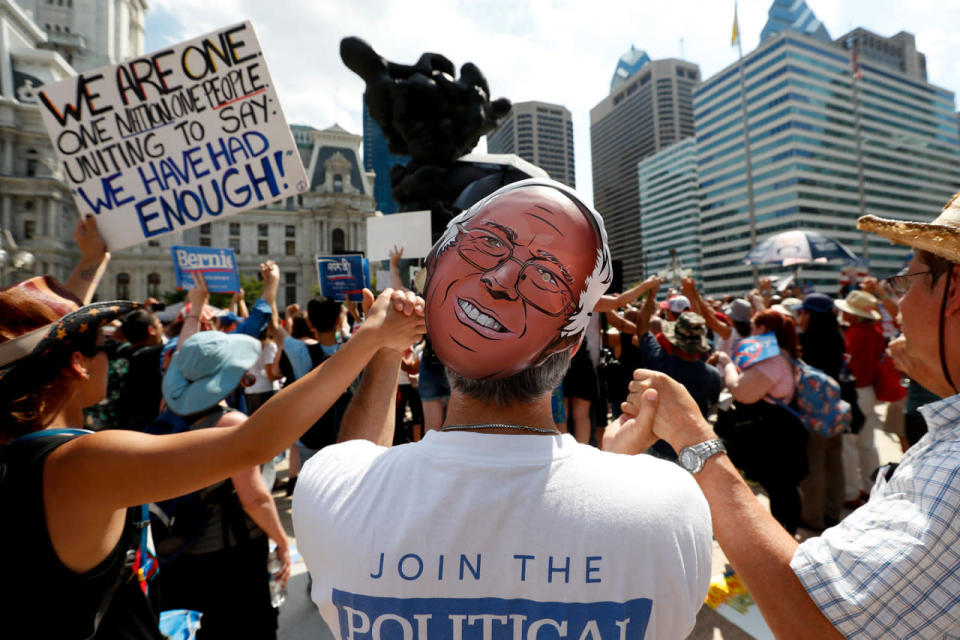 <p>Demonstrators hold hands during a rally near City Hall in Philadelphia, Wednesday, July 27, 2016, during the third day of the Democratic National Convention. (Photo: Alex Brandon/AP)</p>