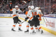 Philadelphia Flyers players celebrate a goal against the Edmonton Oilers during the first period of an NHL hockey game, Wednesday, Oct. 27, 2021 in Edmonton, Alberta. (Jason Franson/The Canadian Press via AP)