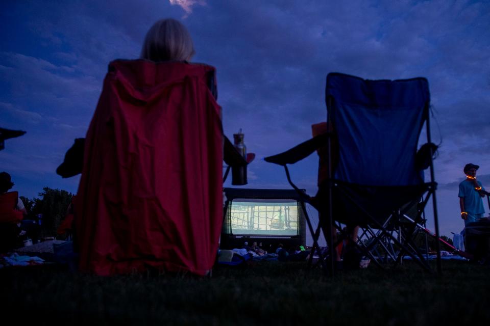 Moviegoers enjoy "The Good Dinosaur" at Eastman Park in Windsor on June 10.