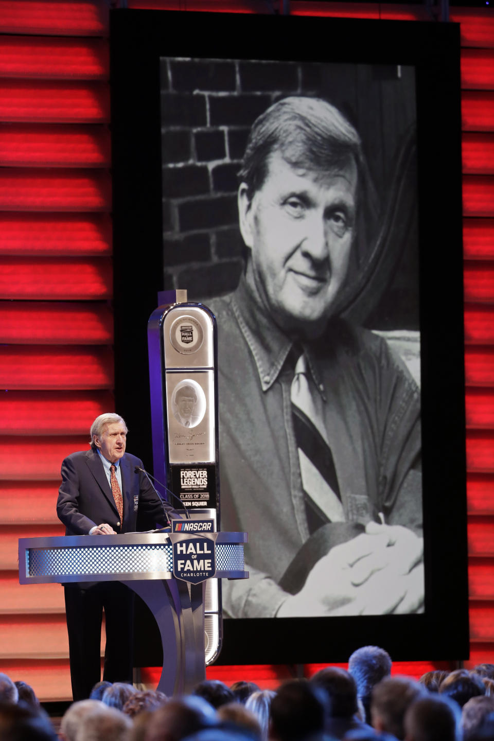 FILE - Ken Squier speaks after being inducted during NASCAR's Hall of Fame induction ceremony in Charlotte, N.C., Friday, Jan. 19, 2018. Squier, a longtime NASCAR announcer, has died. Squier died Wednesday night, Nov. 15, 2023, in Waterbury, Vermont, at the age of 88, according to the management of the local WDEV radio, which he owned. (AP Photo/Chuck Burton, File)