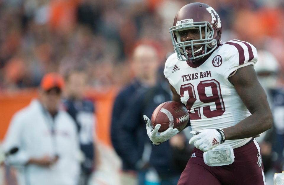 Texas A&M defensive back Deshazor Everett (29) returns a blocked field goal for a touchdown during the NCAA football game between Auburn and Texas A&M on Saturday, Nov. 8, 2014, in Auburn, Ala. 