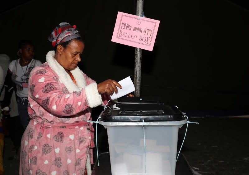 Yerusalem Kabiso, 48, a government employee who lost her brother in the last July's Sidama protest, prepares to cast her vote during the Sidama autonomy referendum in Hawassa