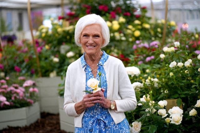 Dame Mary Berry holds the Mary Berry Rose 