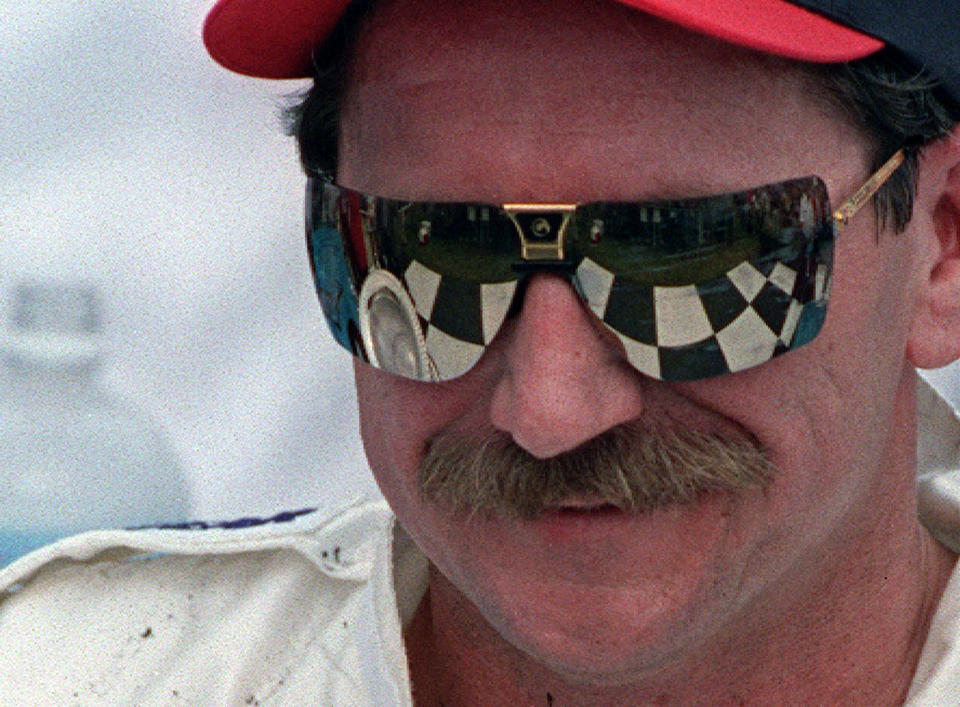 FILE - Dale Earnhardt in victory lane after winning the International Race of Champions in Daytona Beach, Fla. in 1995. To mark NASCAR’s 75th season, The Associated Press interviewed 12 key contributors to the industry on multiple topics. According to the survey, Dale Earnhardt's death in the 2001 Daytona 500 was picked as NASCAR's most pivotal moment. (AP Photo/Terry Renna, File)