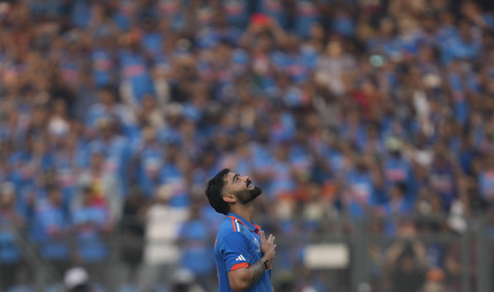 India's Virat Kohli celebrates his century during the ICC Men's Cricket World Cup first semifinal match between India and New Zealand in Mumbai, India, Wednesday, Nov. 15, 2023. (AP Photo/Rafiq Maqbool)