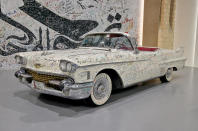 <p>In June 2017, Qatar found itself cast adrift from its fellow Middle Eastern nations in a diplomatic row which wasn't resolved until early 2021. In 2017, the museum invited visitors to write messages of hope on this 1958 <strong>Cadillac Eldorado Biarritz</strong> convertible; even the whitewall tyres are covered.</p>