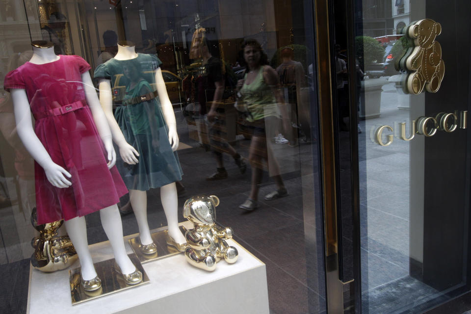 In this July 19, 2012 photo, girls dresses appear on display at the Gucci children's boutique on Fifth Avenue in New York. Gucci's two-level children's boutique on New York's Fifth Avenue, next door to its adult flagship, may have brass teddy bears on the walls and plush child-sized furniture, but the prices for the miniature looks are hardly child's play. (AP Photo/Mary Altaffer)