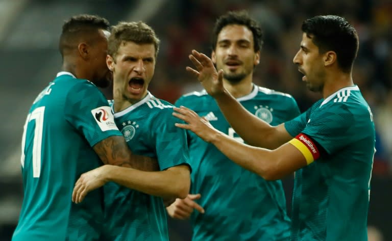 Great leveller: Thomas Mueller equalises for Germany in the 1-1 draw with Spain