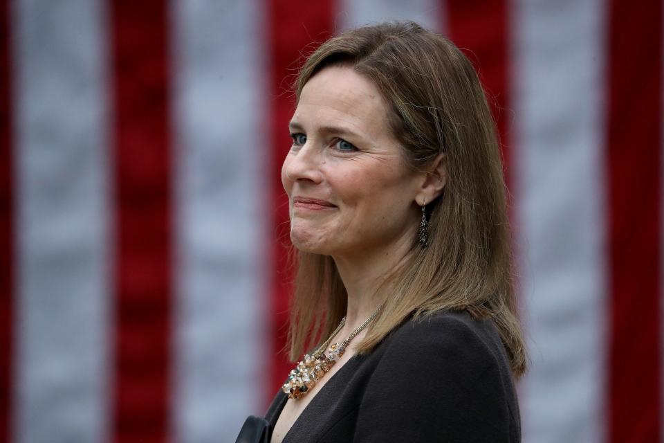 Judge Amy Coney Barrett looks on while being introduced by President Donald Trump as his nominee to the Supreme Court during an event in the Rose Garden at the White House in Washington, Sept. 26, 2020.