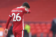 Liverpool's Andrew Robertson reacts disappointed after the English Premier League soccer match between Liverpool and Fulham at Anfield stadium in Liverpool, England, Sunday, March 7, 2021. (Paul Ellis/Pool via AP)