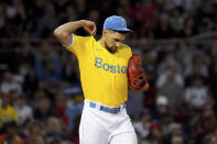 Boston Red Sox starting pitcher Nathan Eovaldi (17) pulls on his jersey between pitches during the third inning of a baseball game against the New York Yankees at Fenway Park, Friday, Sept. 24, 2021, in Boston. (AP Photo/Mary Schwalm)