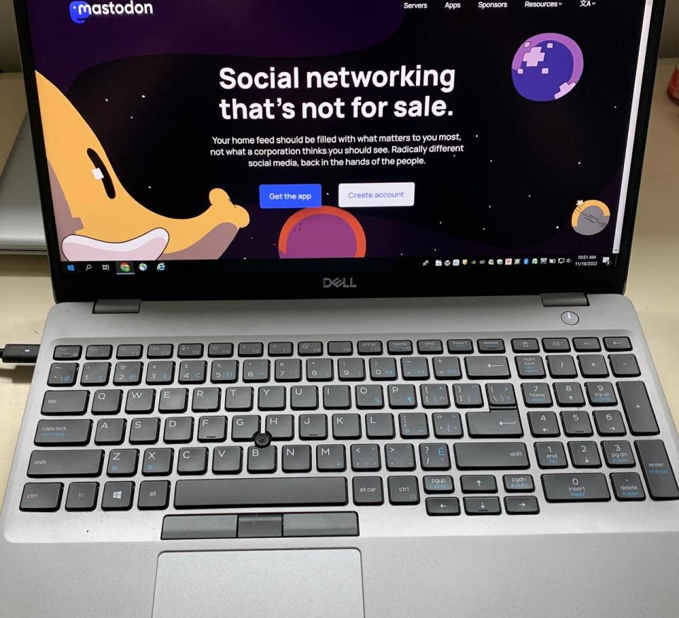 The homepage for social network platform Mastodon is loaded on a laptop.