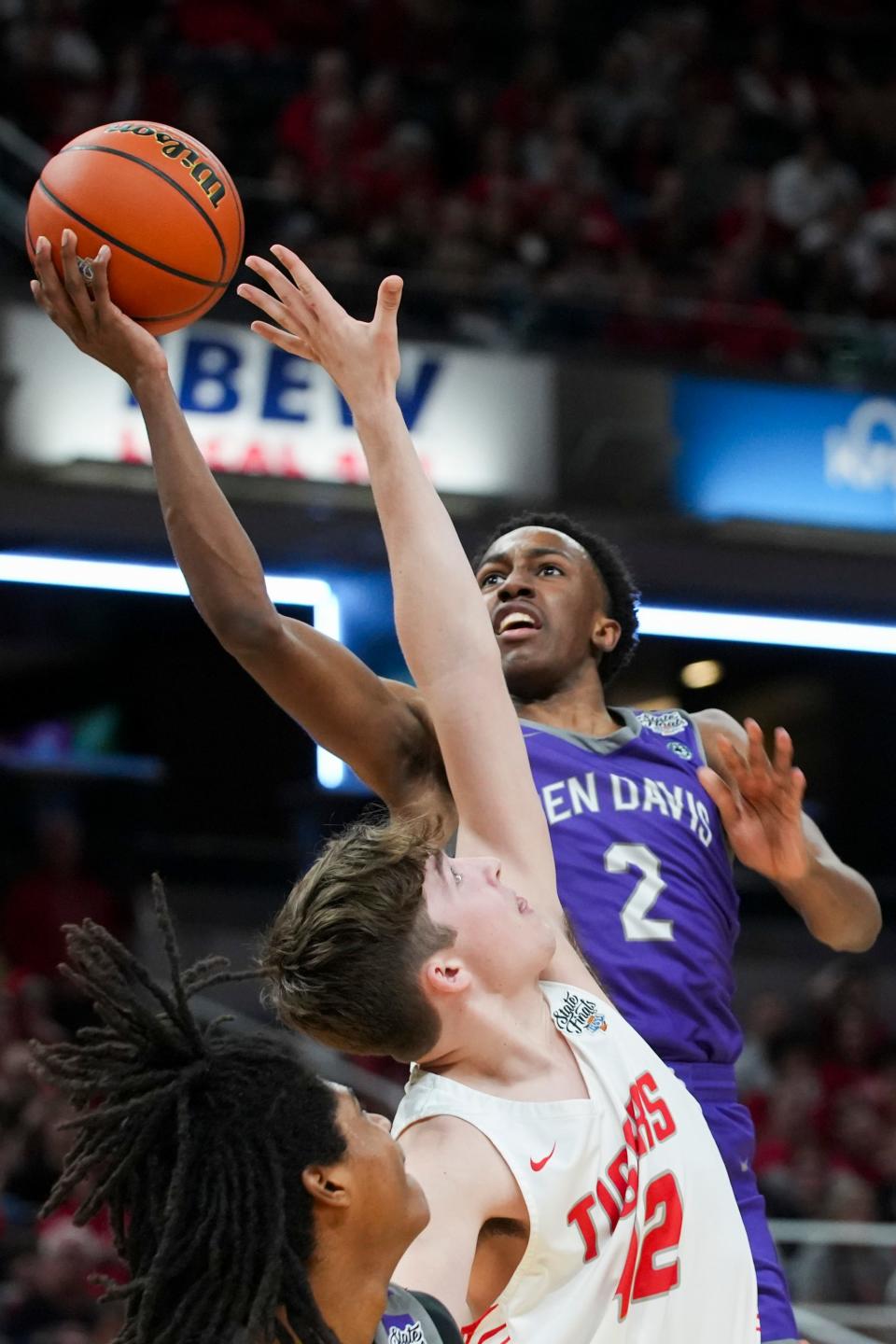 Ben Davis Giants guard Mark Zackery (2) lays the ball up against the Fishers Tigers on Saturday, March 30, 2024, during the IHSAA boys basketball Class 4A state championship game at Gainbridge Fieldhouse in Indianapolis. The Fishers Tigers defeated the Ben Davis Giants 65-56.