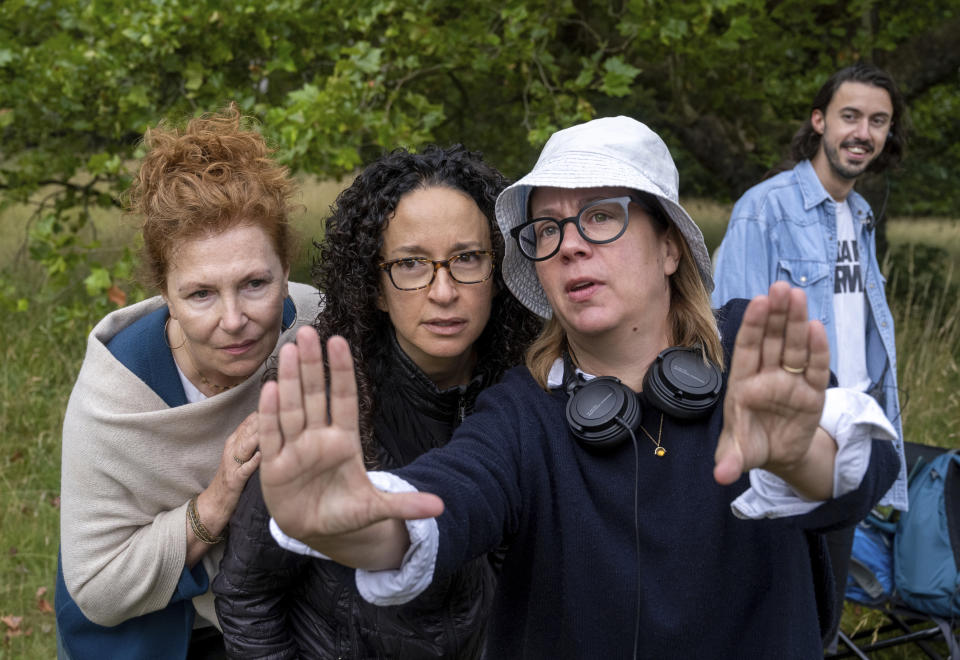 This image released by Netflix shows executive producer Janice Williams, left,showrunner and executive Producer Debora Cahn, center, and director Liza Johnson on the set of "The Diplomat." (Netflix via AP)