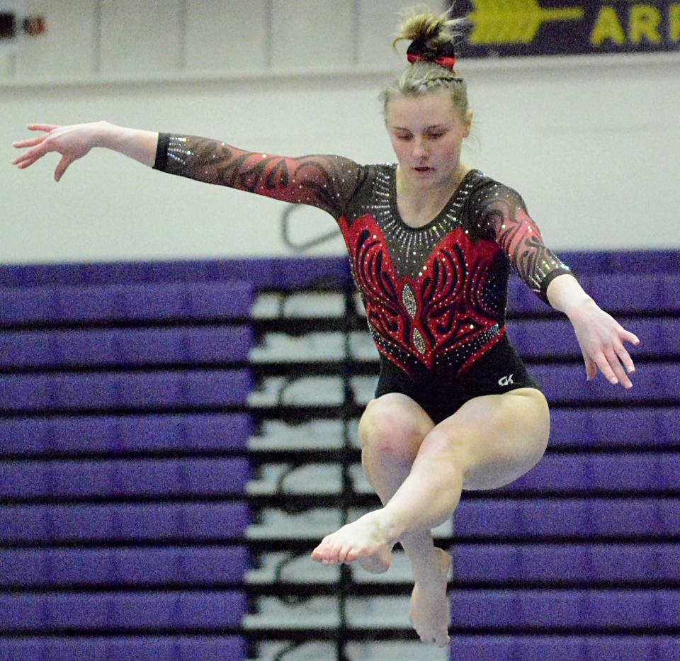 Deuel's MaKia Moe leaps from the balance beam during the Watertown Invitational gymnastics meet on Saturday, Jan. 21, 2023.