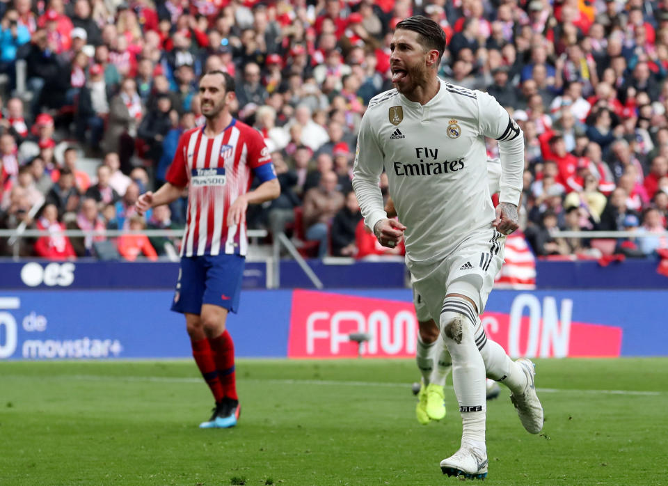 Real Madrid’s Sergio Ramos (right) scored a goal and added an assist in Saturday’s derby against city rival Atletico Madrid. (Reuters/Susana Vera)