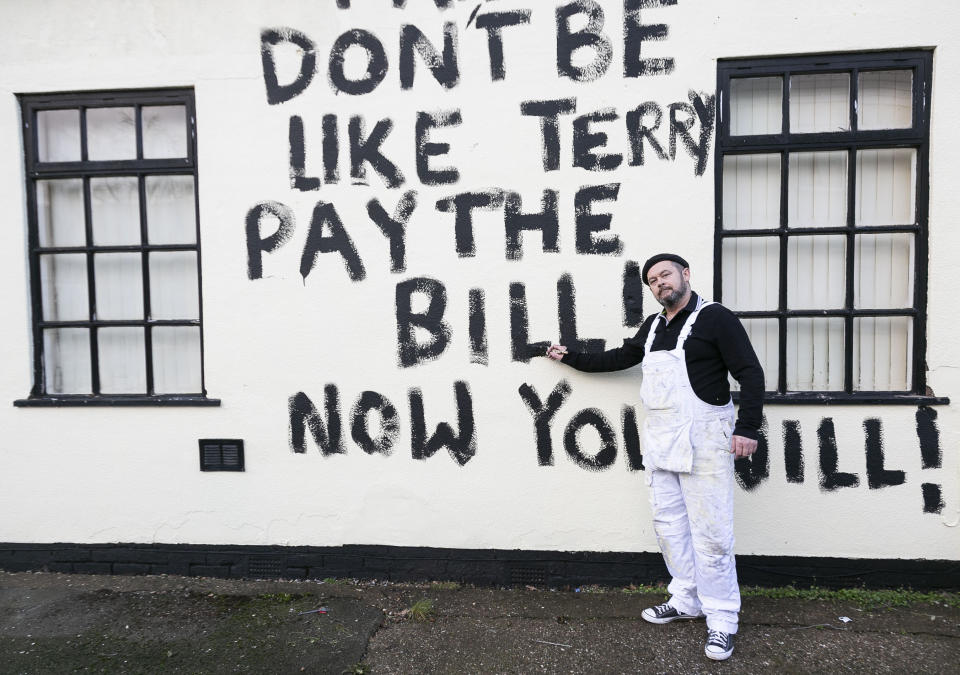 Painter and decorator, Dean Reeves 50, painted black graffiti on a house accusing the owner of not paying him, pictured in Bolsover in Derbyshire, January 17 2020.  SWLEgraffiti