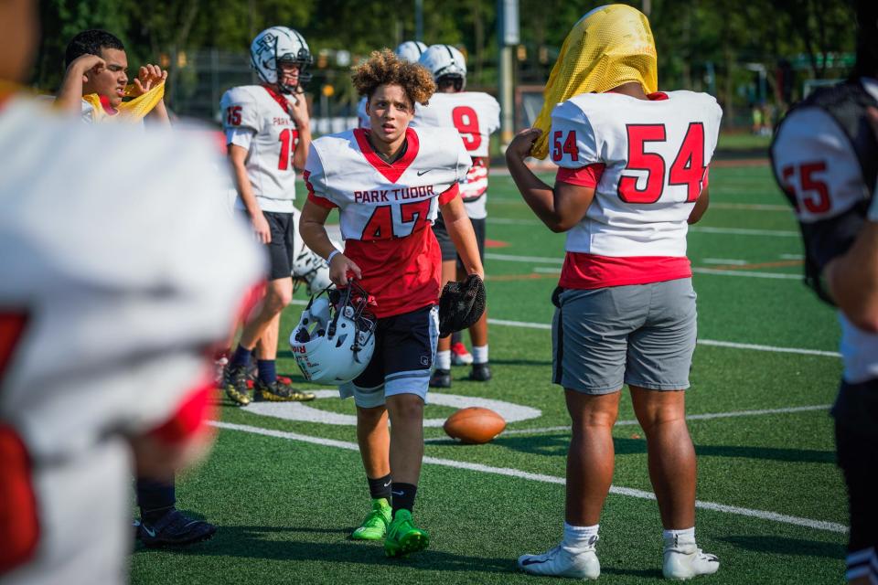 Tanner Berry, (43) a freshman linebacker who was named to WNFC All-Star Showcase and has 4 varsity tackles this year, right, runs drills with teammates on Sept. 14.