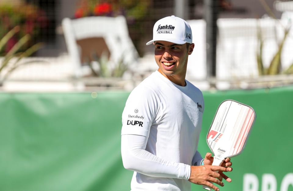 Professional player Ben Johns smiles between points during the Pro Pickleball Association Masters tournament at the La Quinta Resort and Club, Friday, Nov. 12, 2021, in La Quinta, Calif. 