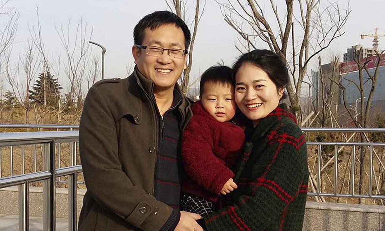 <span>The human rights lawyer Wang Quanzhang (left) and his wife Li Wenzu with their son in 2015. The CHRD report included testimony that in March police had searched the new school of Wang’s son.</span><span>Photograph: Wang Quanxiu/AP</span>