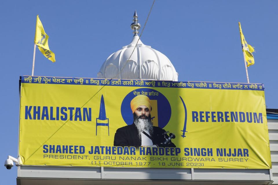 A banner with the image of Sikh leader Hardeep Singh Nijjar at the Guru Nanak Sikh Gurdwara temple, site of his June 2023 killing, in Surrey, Canada (REUTERS)
