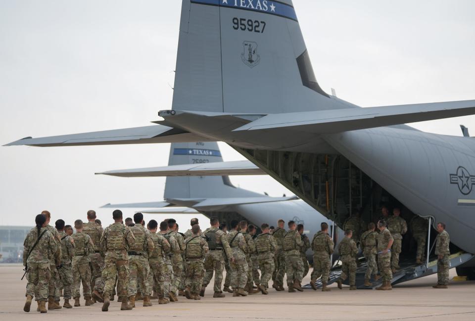 Texas Army National Guard troops deploy from Austin-Bergstrom International Airport on Monday to secure the Texas-Mexico border in anticipation of the end of Title 42 later this week.