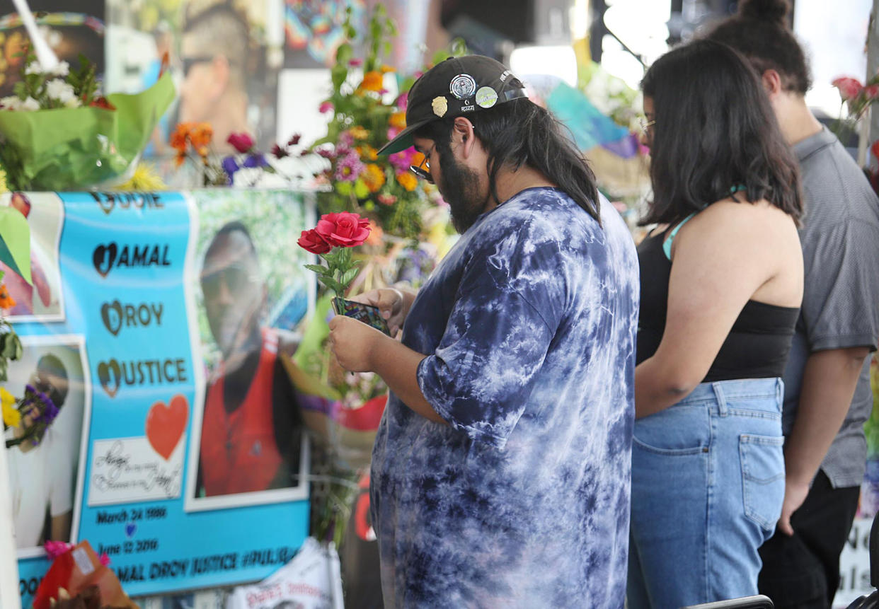 Mourners viewed the site of the Pulse nightclub shooting in Orlando, Fla., on June 12, 2019. This year marks the four-year anniversary of the tragic event that killed 49 victims, many Hispanic and LGBTQ. (Photo: Stephen M. Dowell/Orlando Sentinel/Tribune News Service via Getty Images)