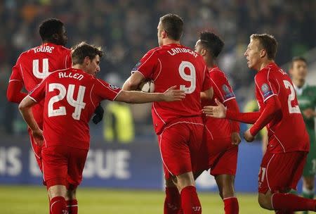 Rickie Lambert (C) of Liverpool celebrates with team-mates after scoring against Ludogorets during their Champions League Group B soccer match at Vassil Levski stadium in Sofia, November 26, 2014. REUTERS/Stoyan Nenov