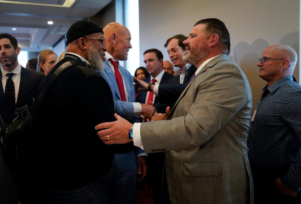 Marty McNair, left, talks with Matthew Mangine Sr. during an event in Washington, D.C., to advocate for legislation to provide money for AEDs and training in schools. McNair and Mangine both lost sons who were youth athletes. March 29, 2023.