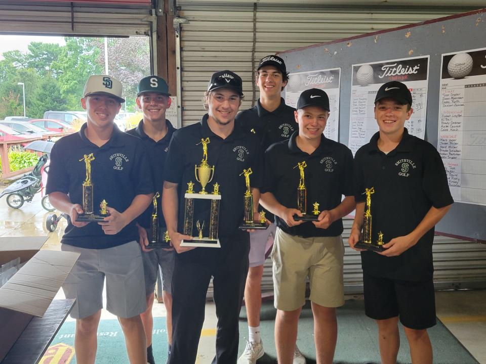 Smithville celebrates its victory at the Deegan Bee Memorial Invitational.