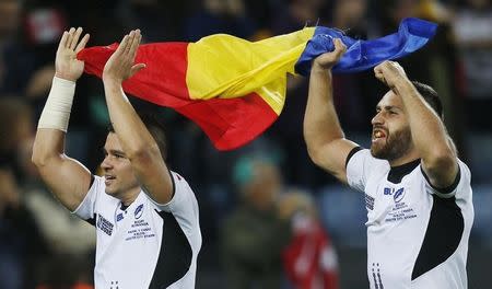 Rugby Union - Canada v Romania - IRB Rugby World Cup 2015 Pool D - Leicester City Stadium, Leicester, England - 6/10/15 Romania's Madalin Lemnaru (R) and Vali Calafeteanu celebrate winning the game Action Images via Reuters / Peter Cziborra Livepic