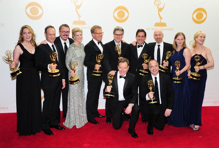 Actor Bryan Cranston (centre) and members of 'Breaking Bad' pose in the press room during the 65th Annual Primetime Emmy Awards in Los Angeles, California on September 22, 2013