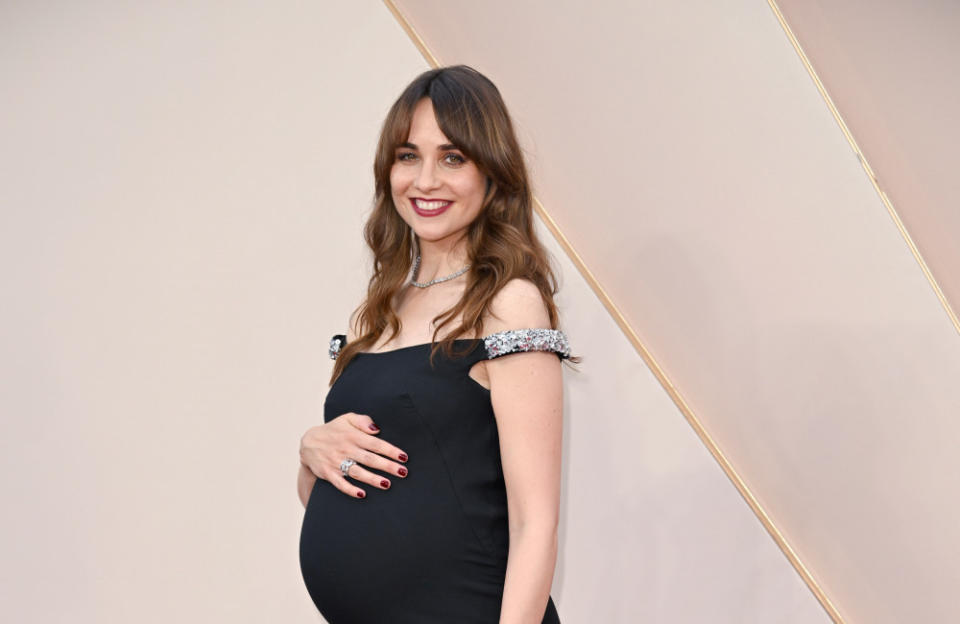Tuppence Middleton placing a hand on her baby bump at the Downton Abbey: A New Era premiere credit:Bang Showbiz