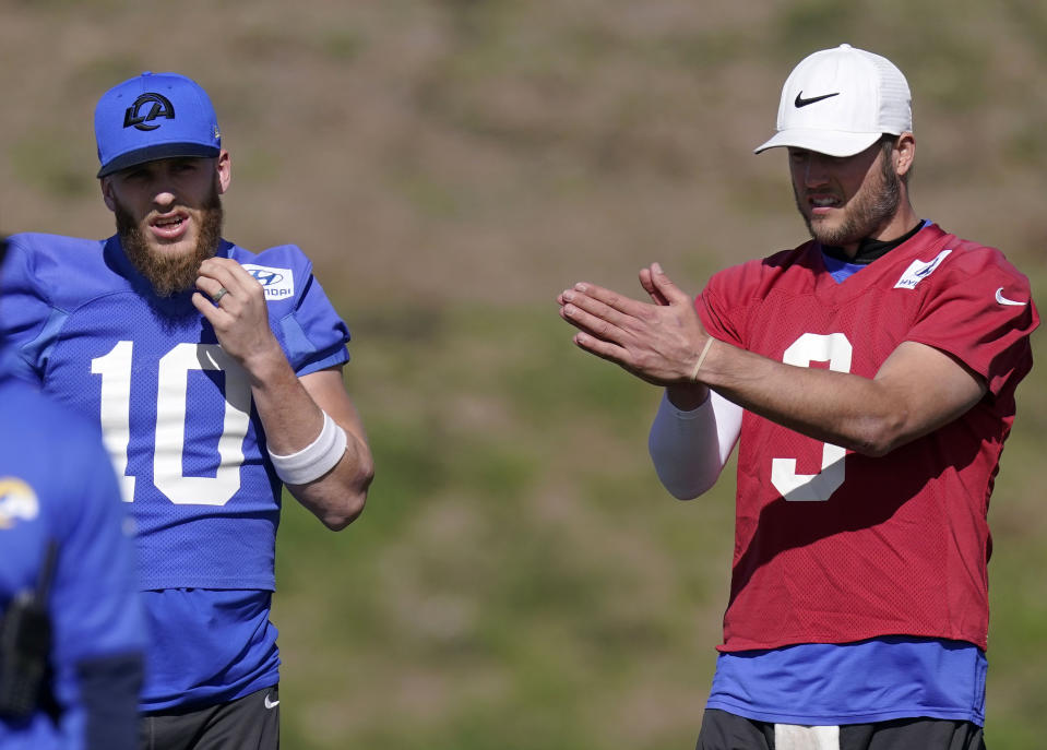 Los Angeles Rams wide receiver Cooper Kupp, left, talks with quarterback Matthew Stafford during an NFL football practice Friday, Jan. 28, 2022, in Thousand Oaks, Calif., ahead of their NFC championship game against the San Francisco 49ers on Sunday. (AP Photo/Mark J. Terrill)