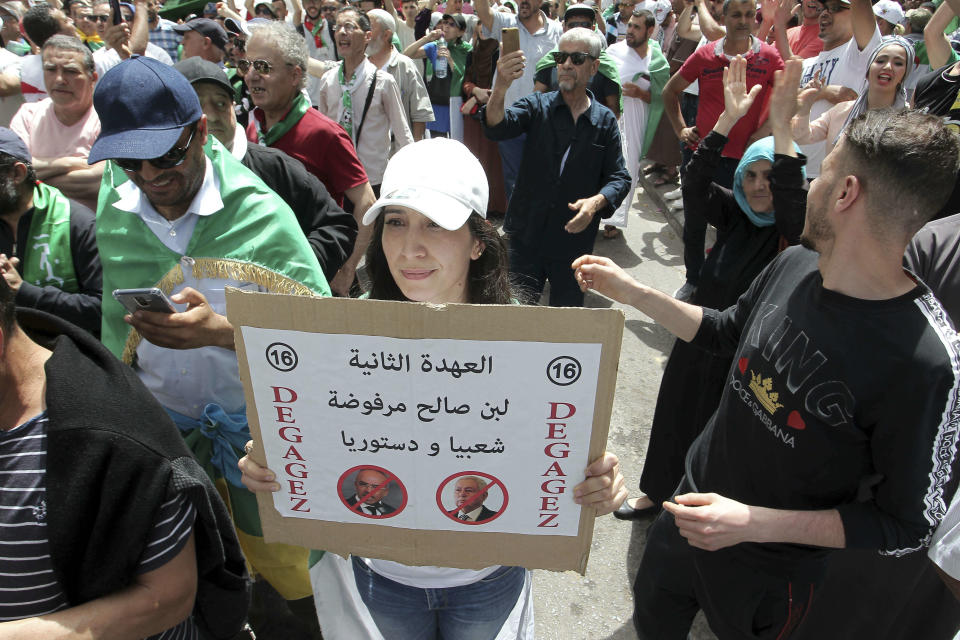 Algerian protesters gather during an anti-government demonstration in the centre of the capital Algiers, Algeria, Friday, June 7, 2019. Banner in Arabic reads "No to PM Bensaleh's second mandate". (AP Photo/Fateh Guidoum)