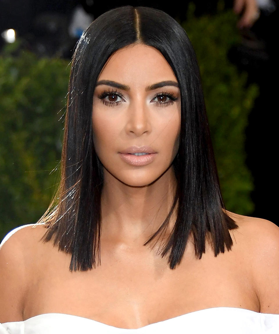 <p>Kim Kardashian is channeling the '90s supermodels with her smooth, flyaway-free hair. The blunt lob length brings the look into the current decade. </p>