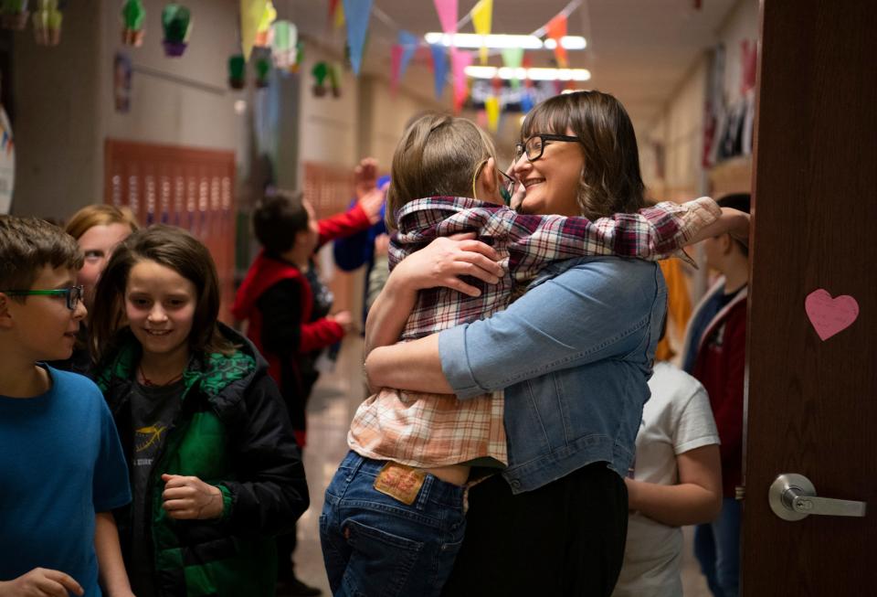 Silas Guess, left, hugs his mother Brandie Roca-Guess, right, as they celebrate his last day of school at Oakdale Elementary School in Boonville, Ind., Wednesday, March 8, 2023. Guess was having a pizza party with his classmates before heading to Cincinnati Children's Hospital for a TPIAT- Total Pancreatectomy with Islet Auto Transplantation where he will spend 10 -14 weeks in recovery. The fourth grader was diagnosed with chronic pancreatitis, a very rare disease in children, in April 2020. He was also diagnosed with Carnitine Deficiency, Nephrocalcinosis, Autosomal Dominant Polycystic Kidney Disease, and Focal Epilepsy and was approved for the surgery in August.