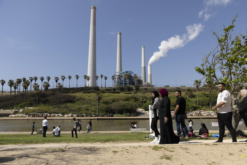 HADERA, ISRAEL - APRIL 12: People hang out at the beach near the Orot Rabin Power Station amid fears of Iran attack after it blamed Israel for a strike on its consulate in Syria on April 12, 2024 in Hadera, Israel. April 7th marked six months since Hamas led an attack on Israel, killing 1,200 people and taking around 250 people hostage. In response, Israel launched a retaliatory war in Gaza that has killed more than 33,000 people, according to the Gazan health ministry. As the latest round of ceasefire negotiations have stalled, the humanitarian crisis worsens in Gaza, while more than 100 Israeli hostages remain in captivity. (Photo by Amir Levy/Getty Images)