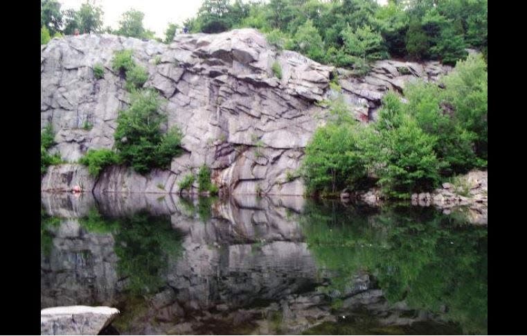 The Ledge is an 80-foot high outcropping overlooking an old quarry in the Fall River Freetown State Forest.