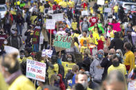 FILE - In this March 13, 2021, file photo, parents, students, teachers and supporters march during a rally for San Francisco public schools to reopen during the coronavirus pandemic in San Francisco. Now that schools have welcomed students back to classrooms, they face a new challenge: a shortage of teachers and staff the likes of which some districts say they have never seen. Public schools have struggled for years with teacher shortages, but the coronavirus pandemic has exacerbated the problem. (AP Photo/Jeff Chiu, File)