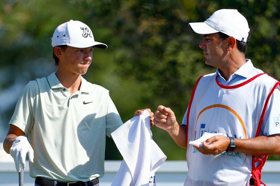 Miles Russell of Jacksonville Beach (left) talks with caddie and swing coach Ramon Bescansa during Saturday's third round of the Korn Ferry Tour LECOM Classic, at the Lakewood National Commander Course in Lakewood Ranch.