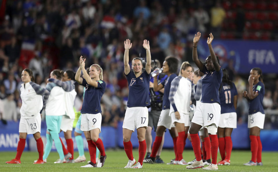 France players celebrate at the end of the Women's World Cup Group A soccer match between Nigeria and France at the Roazhon Park in Rennes, France, Monday, June 17, 2019. France beat Nigeria 1-0. (AP Photo/Vincent Michel)